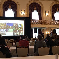 Image showing an opening slide at ASSETS'19 with Jeff Bigham visible on the stage