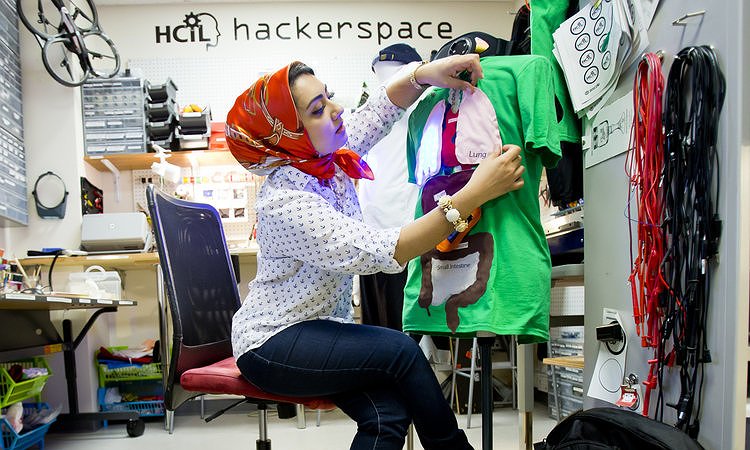 Co-inventor of BodyVis Leyla Norooz sitting next to her invention