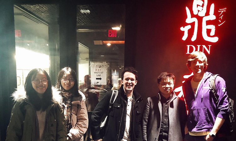 Five lab members standing in front of Din Tai Fung