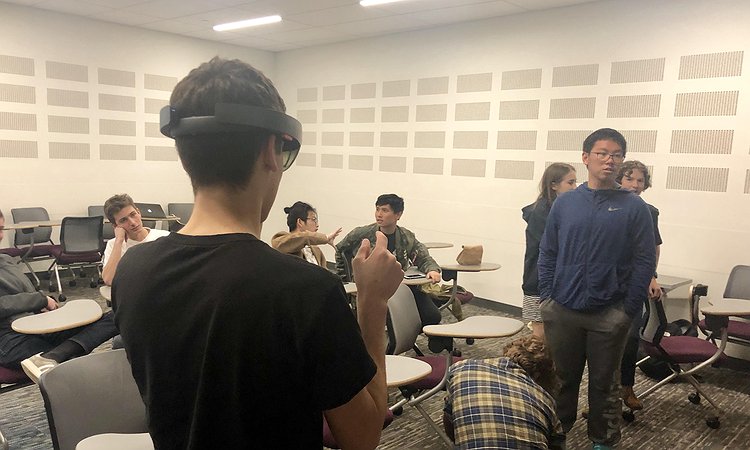 High school students trying Dhruv's AR-based captioning system