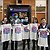 A picture of UW students holding up ASSETS'22 t-shirts. From left-to-right in the photo , Judy Kong, Kelly Mack, Jon E. Froehlich, Zhuohao (Jerry) Zhang, Chu Li, Xia Su, and Jaewook Lee.