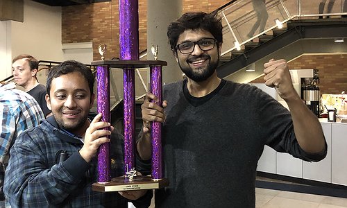 Venkatesh and Dhruv holding the TGIF trophy