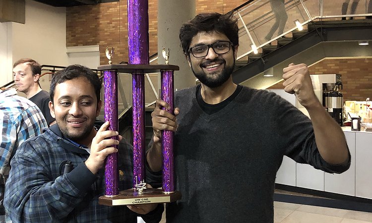 Venkatesh and Dhruv holding the TGIF trophy
