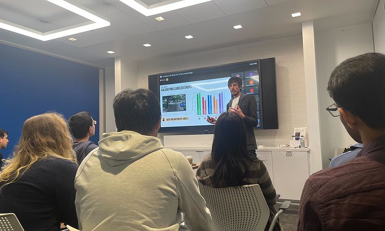 A picture of Jon giving a talk at AI2