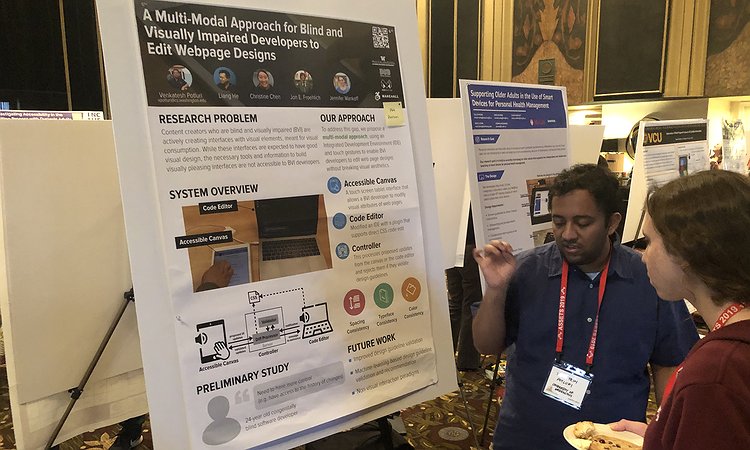 Venkatesh showing our UITalk poster at ASSETS'19