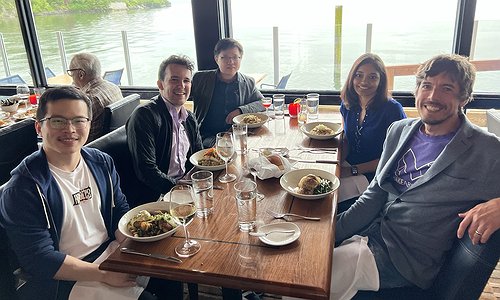 A picture of the Makeability Lab eating at Ray's Boathouse with water in the background