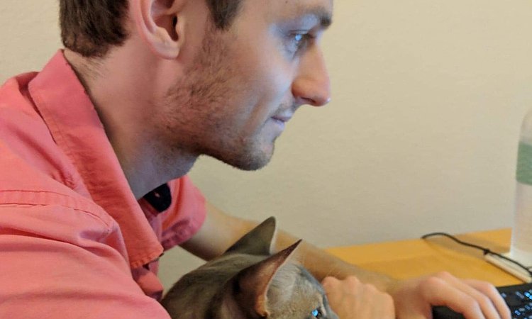 Mikey working with his cat
