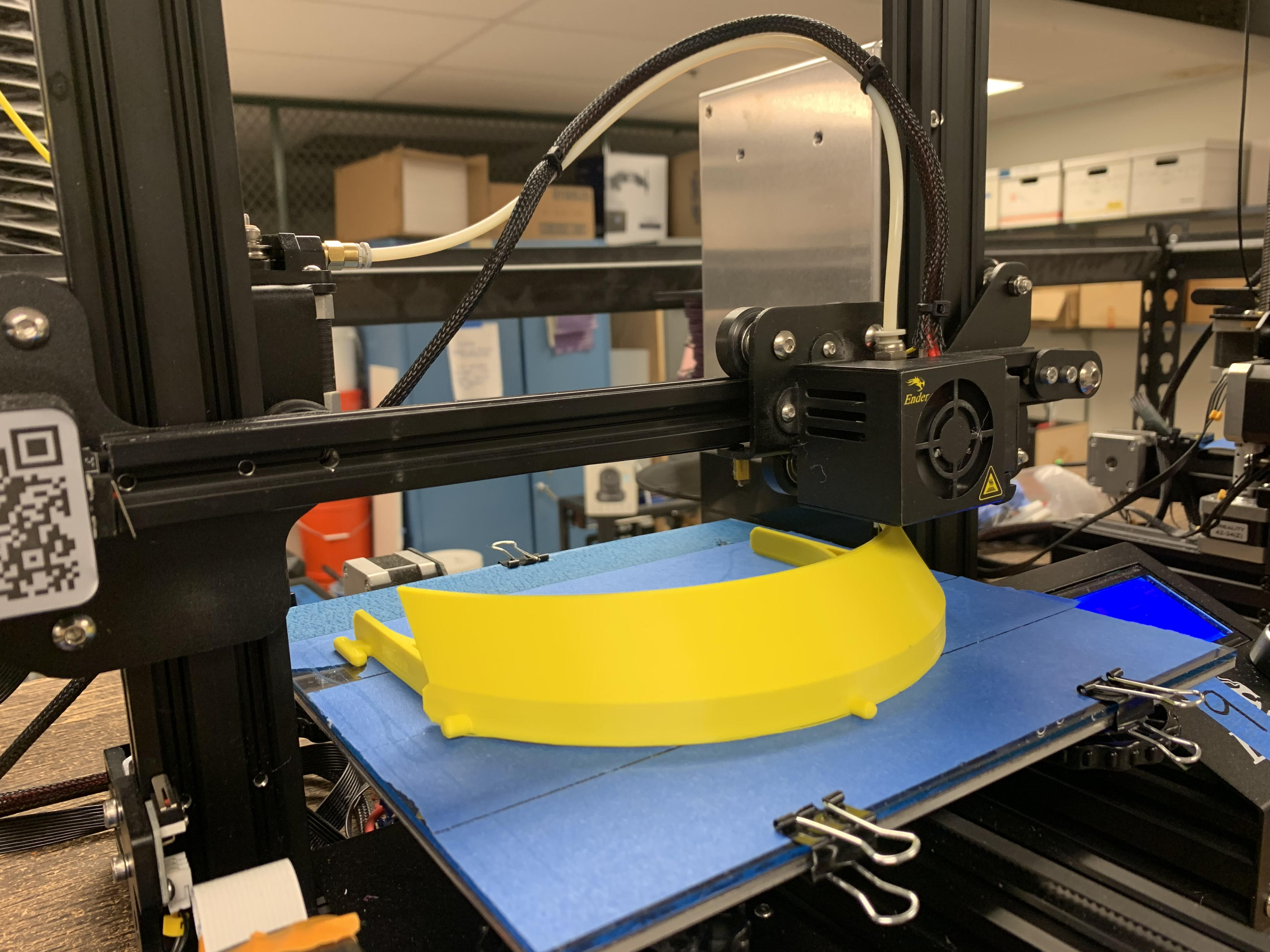 Picture of a PPE mask part on a 3D printer bed