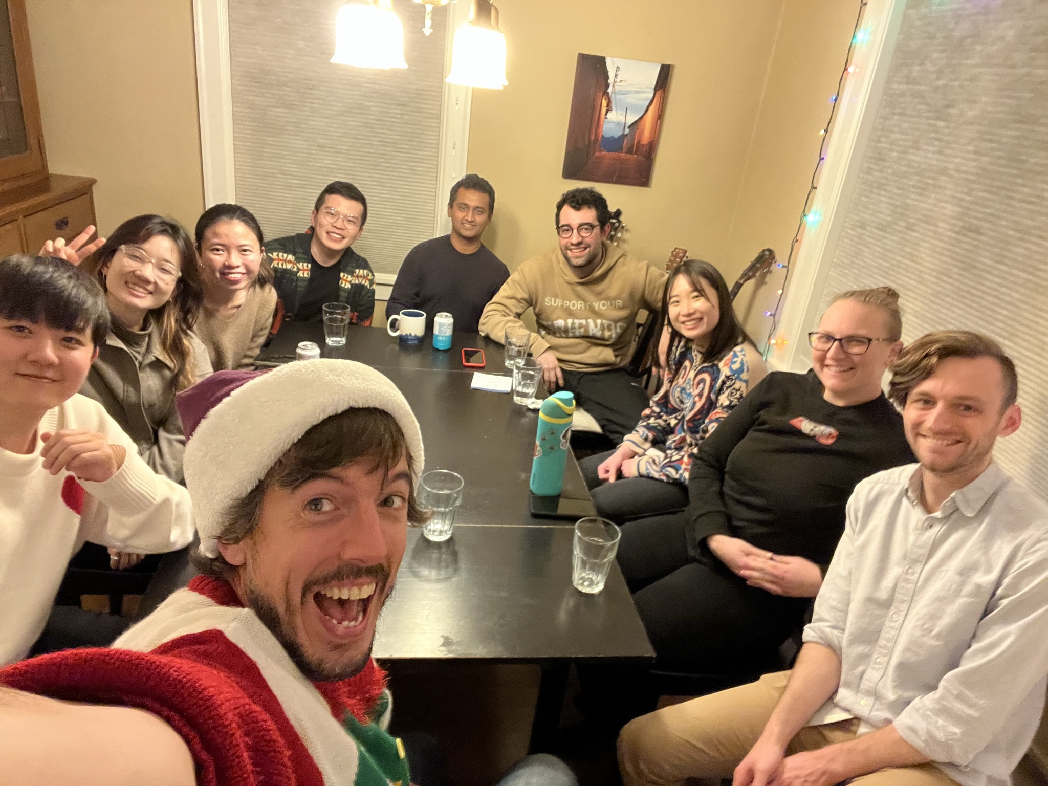 A picture of the Makeability Lab sitting around a table enjoying the potluck
