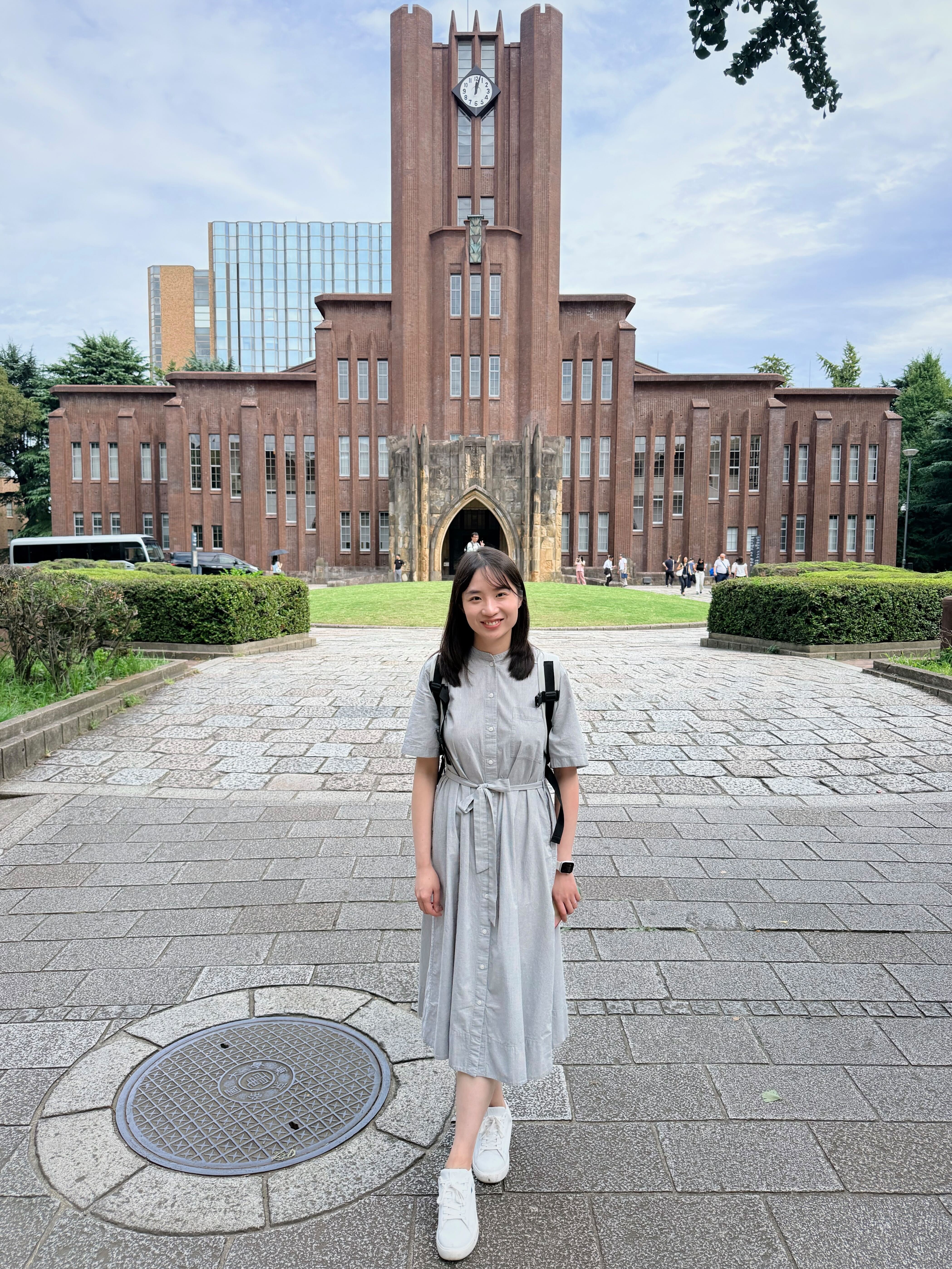 Chu Li standing in front of a U Tokyo building